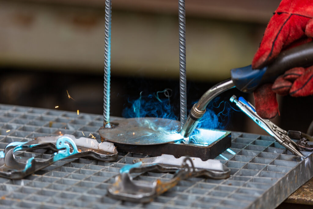 details of welding activities a welder is welding steel compon